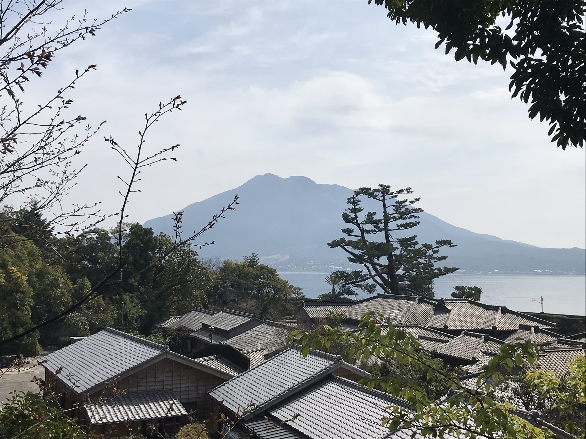 Sakurajima viewed across a traditional Kagoshima landscape
